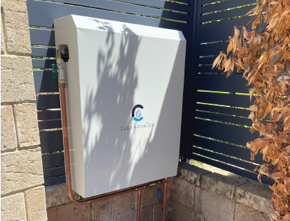 Cleanpanion outdoor filtration enclosure installed beside a fence